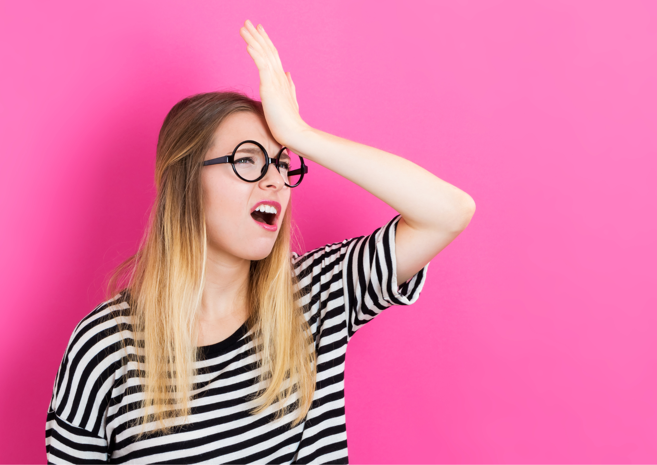 Lady with hand oh her forehead and mouth open